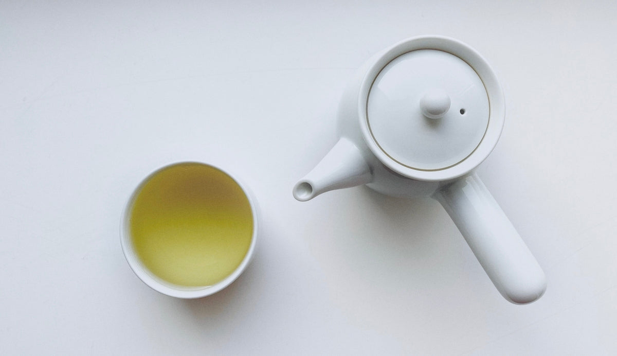 Elegant Porcelain Tea Cup and Ceramic Tea Jar with Yakiobi Glaze for Zen Moments