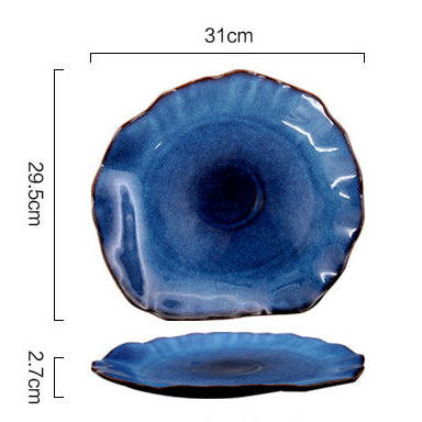 Blue ceramic plate with dimensions and weight information on a white background