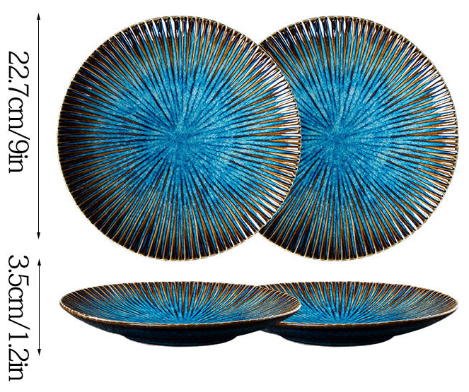 Two blue ceramic plates with decorative patterns and measurements on a white background.